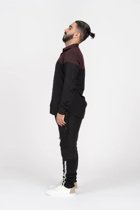 A young man throwing his head back