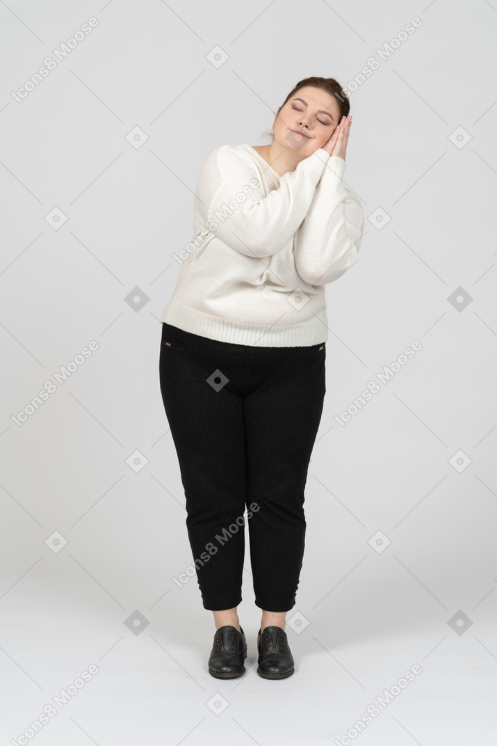 Front view of a sleepy plus size woman in casual clothes
