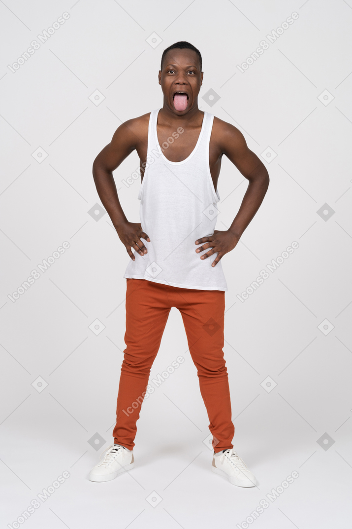 Man in tank top sticking his tongue out