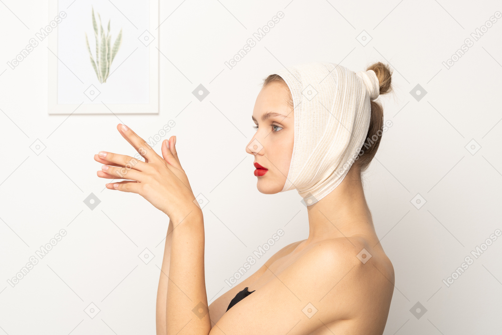 Side view of a woman with head bandage holding hands together