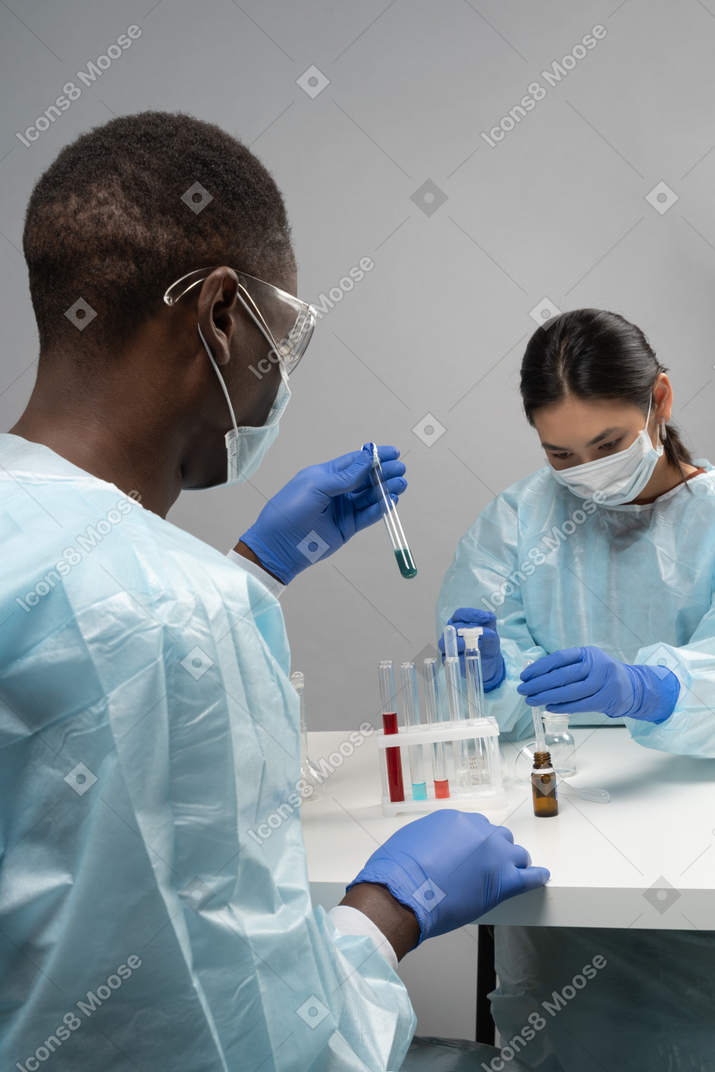 Two medical workers with tubes