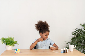 Good looking cute girl doing science at the table