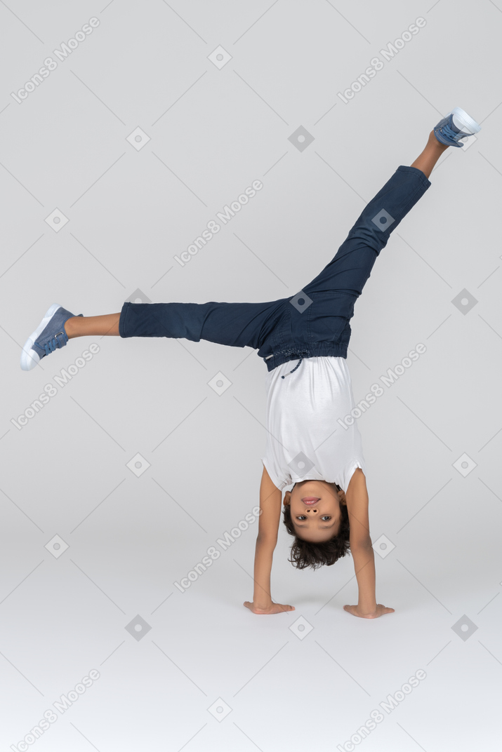 A boy standing on hands