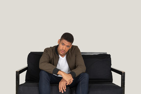 Young man sitting on the sofa