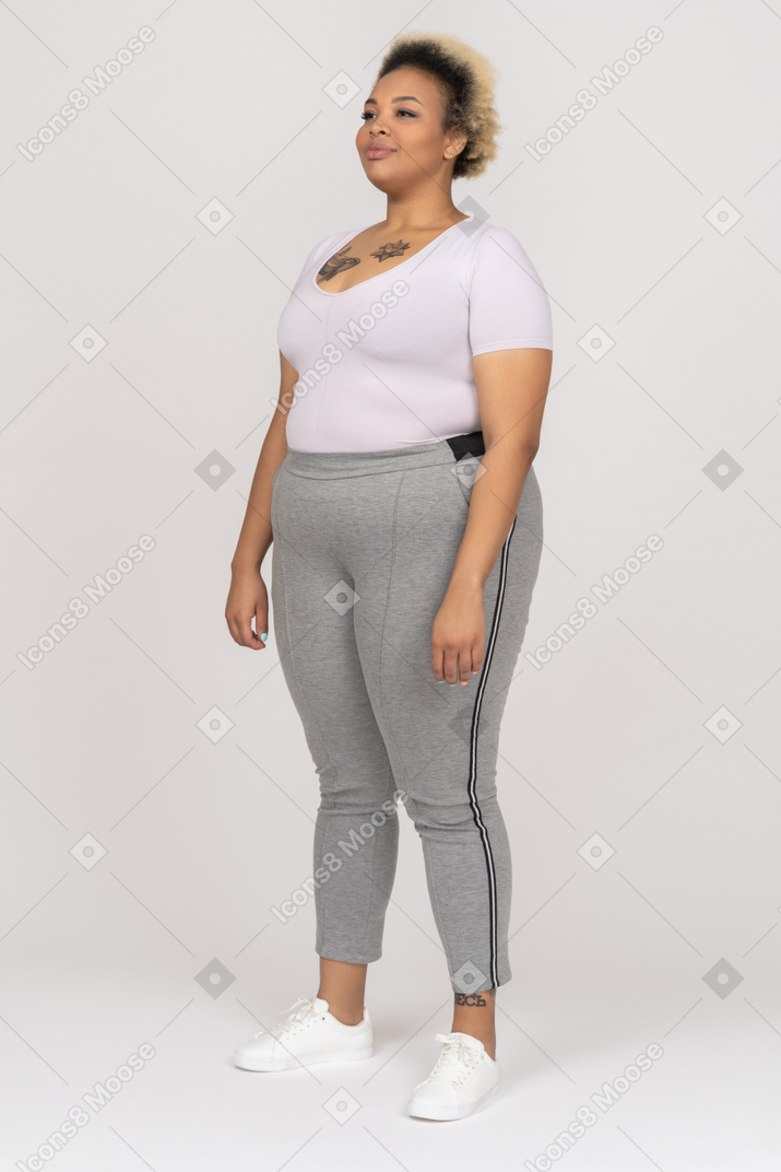 Full length portrait of a cheerful plump afro woman