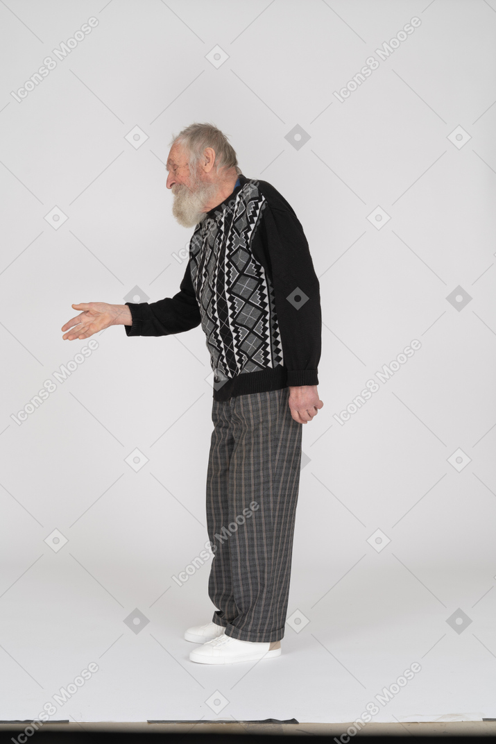 Side view of old man offering handshake