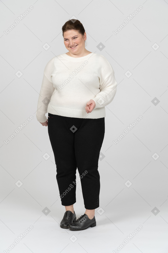 Happy plus size woman in casual clothes smiling