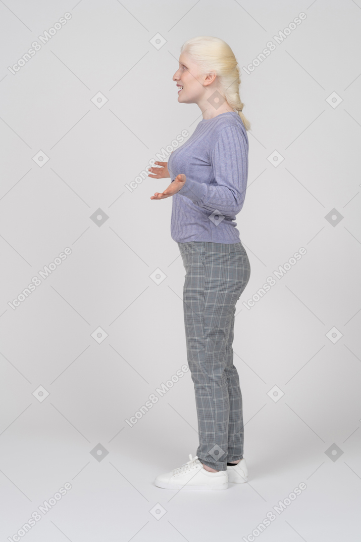 Side view of a girl spreading arms