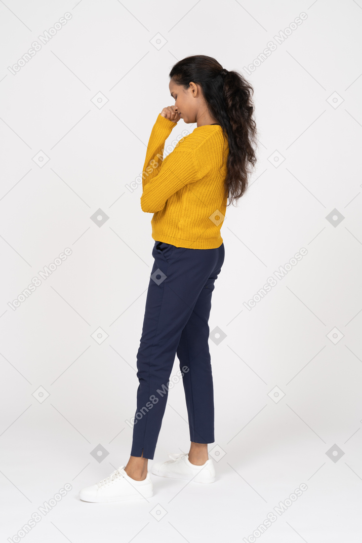 Upset girl in casual clothes standing in profile