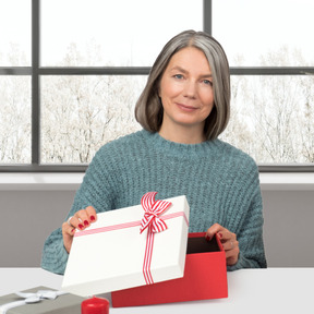 Woman giving you a christmas present