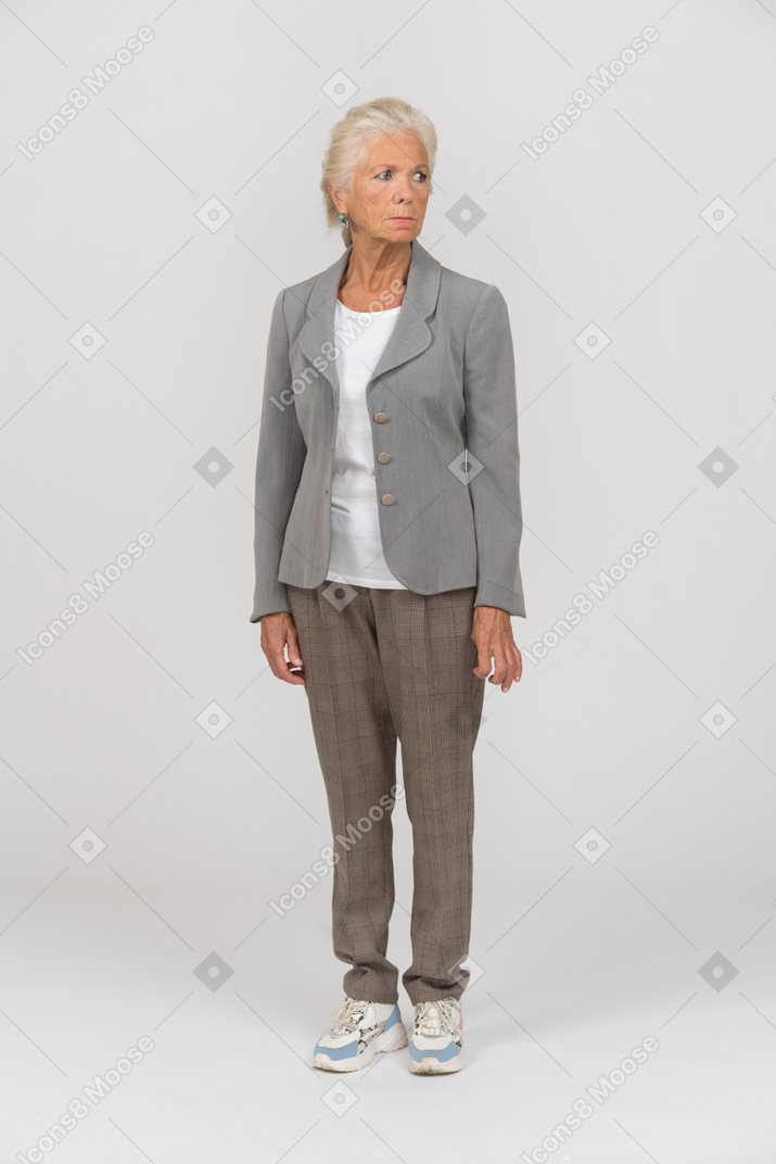 Front view of a sad old woman in suit