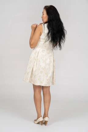 Woman in a white dress standing