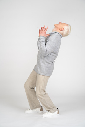 Side view of a distressed man looking up