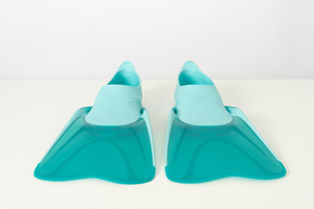 Blue swimming fins on a white background