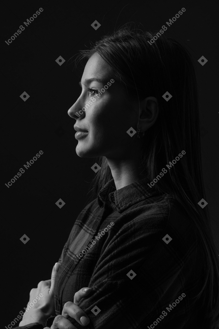 Black and white photo of woman with crossed arms