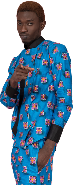 Black man in blue pajamas pointing