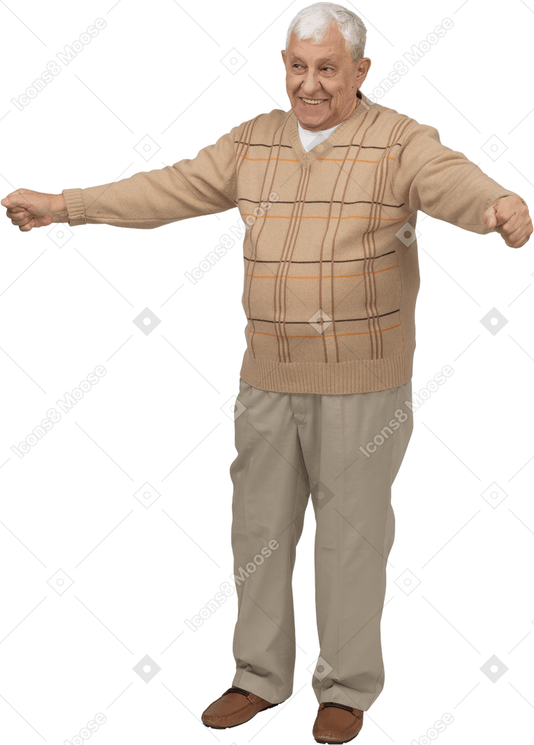 Front view of a happy old man in casual clothes standing with outstretched arms