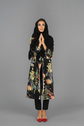 Portrait of a praying muslim woman