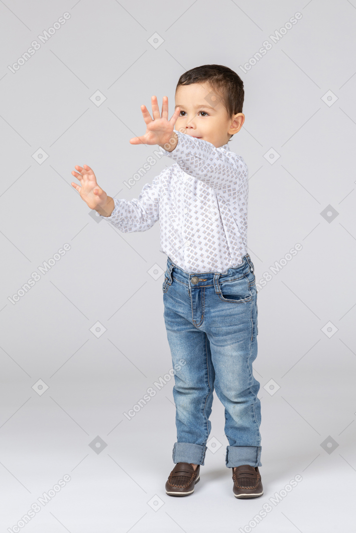 Cute little boy making high five