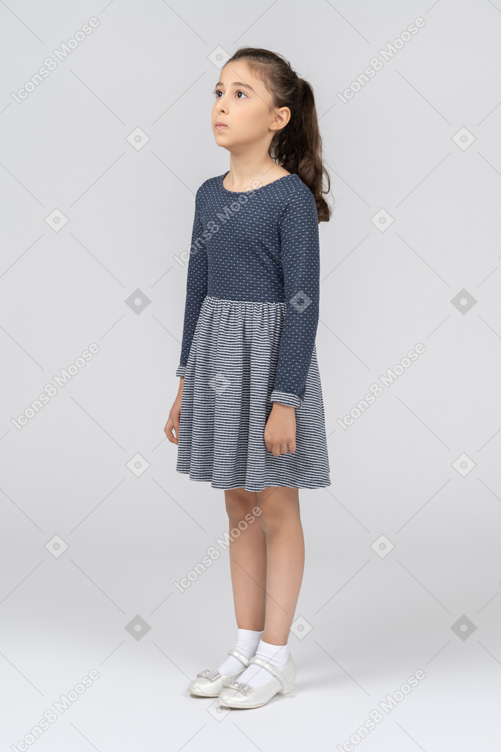 Front view of a girl standing with arms at sides