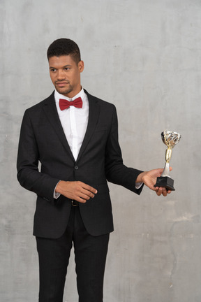 Man in suit declining an award