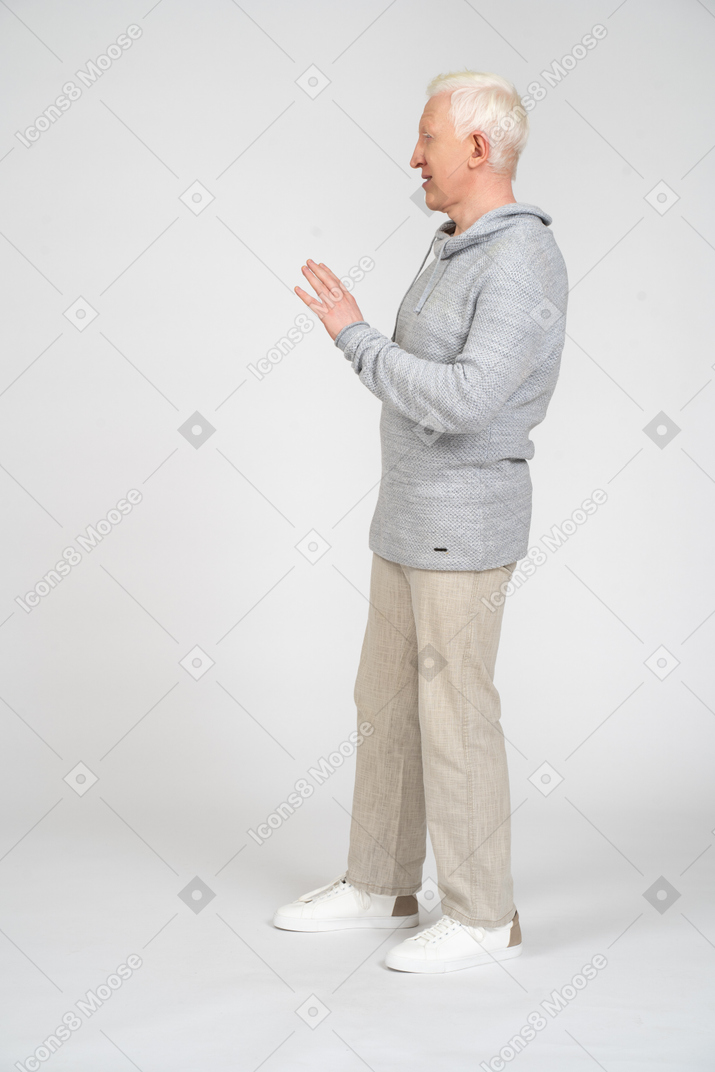 Seitenansicht eines mannes mit winkender hand