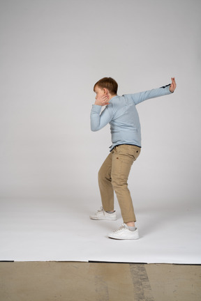 Person standing on a wall with his arms outstretched