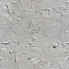 Old cracked paint layer on concrete wall