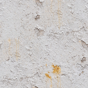 Old cracked paint layer on concrete wall
