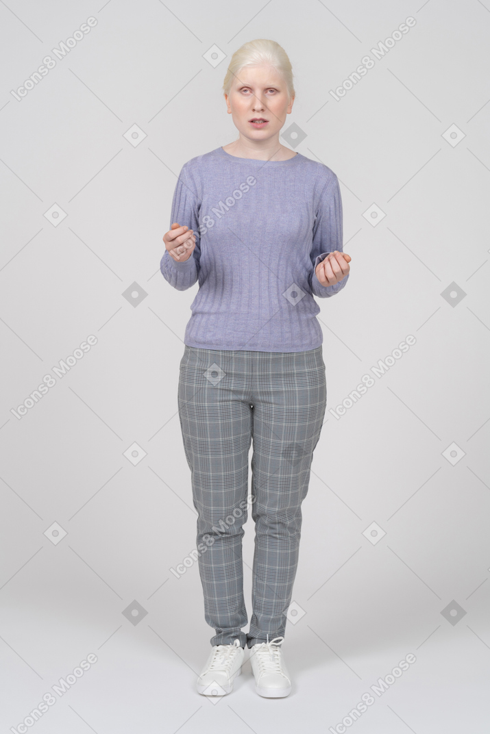 Young woman gesturing and explaining something