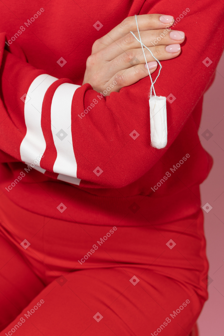 Woman holding a swab in hand
