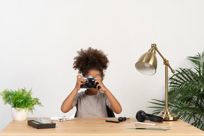 Cute girl taking a photo shot