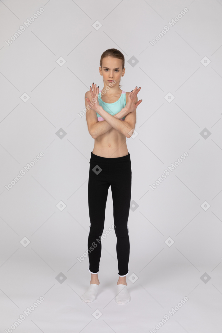 Front view of teen girl making stop gesture