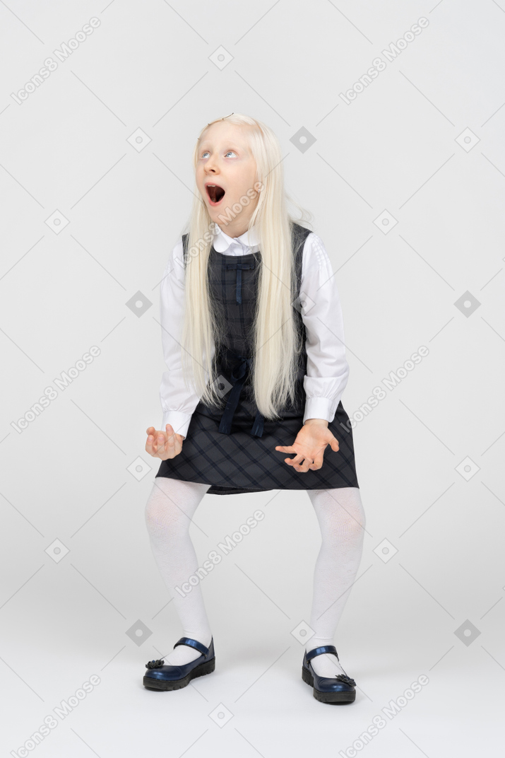 Schoolgirl looking shocked with her mouth wide open