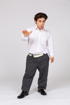 Young man showing stop gesture with hand