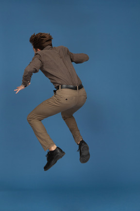 A jumping slim young man