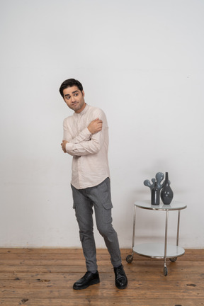 Confident man in shirt standing in front of camera