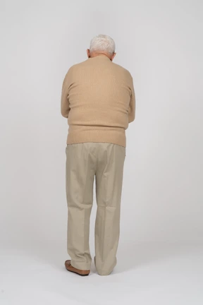 Rear view of an old man in casual clothes
