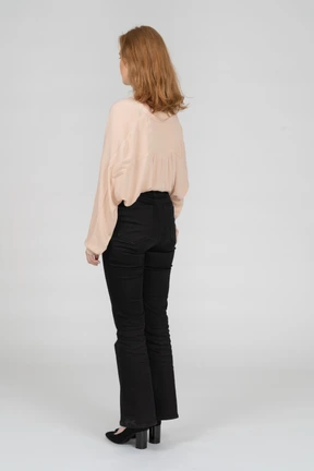 Back view of young woman standing