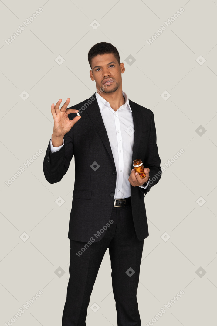 African american man holding pills