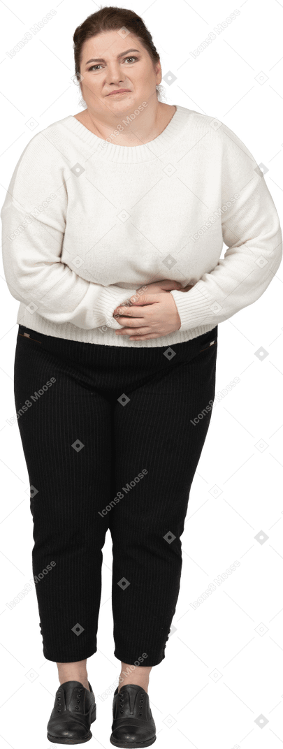 Plump woman in casual clothes suffering from stomachache