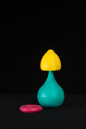 Blue enema, lemon and pink expander on the black background