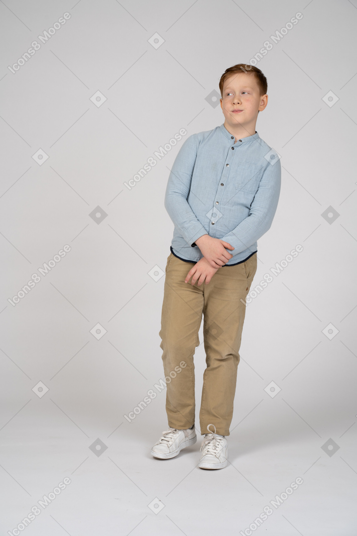 Front view of a boy looking at something with interest