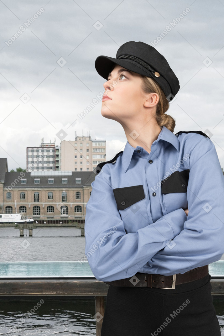 Policewoman in uniform looking away