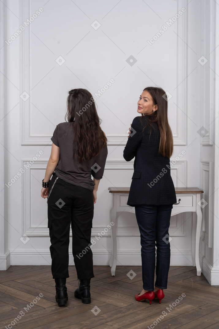 Back view of two smiling women