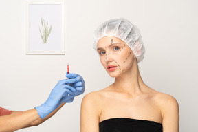 Young woman about to get botox injection