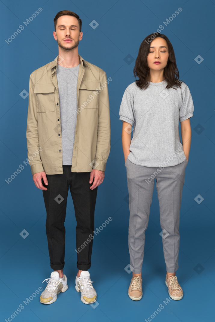Nice couple standing with closed eyes