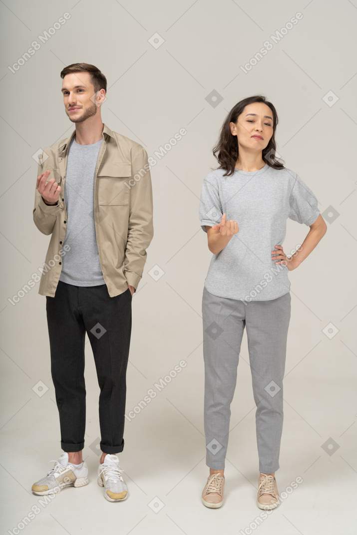 Young couple luring with finger