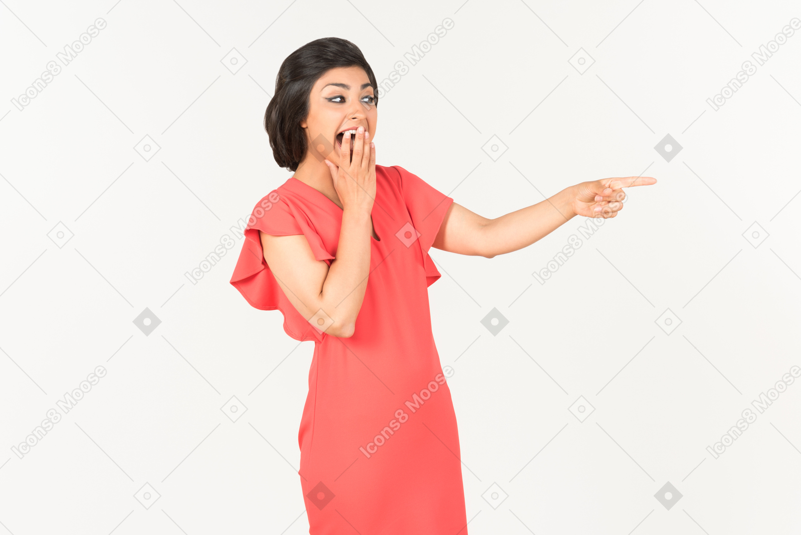 Young indian woman pointing at something and laughing hard
