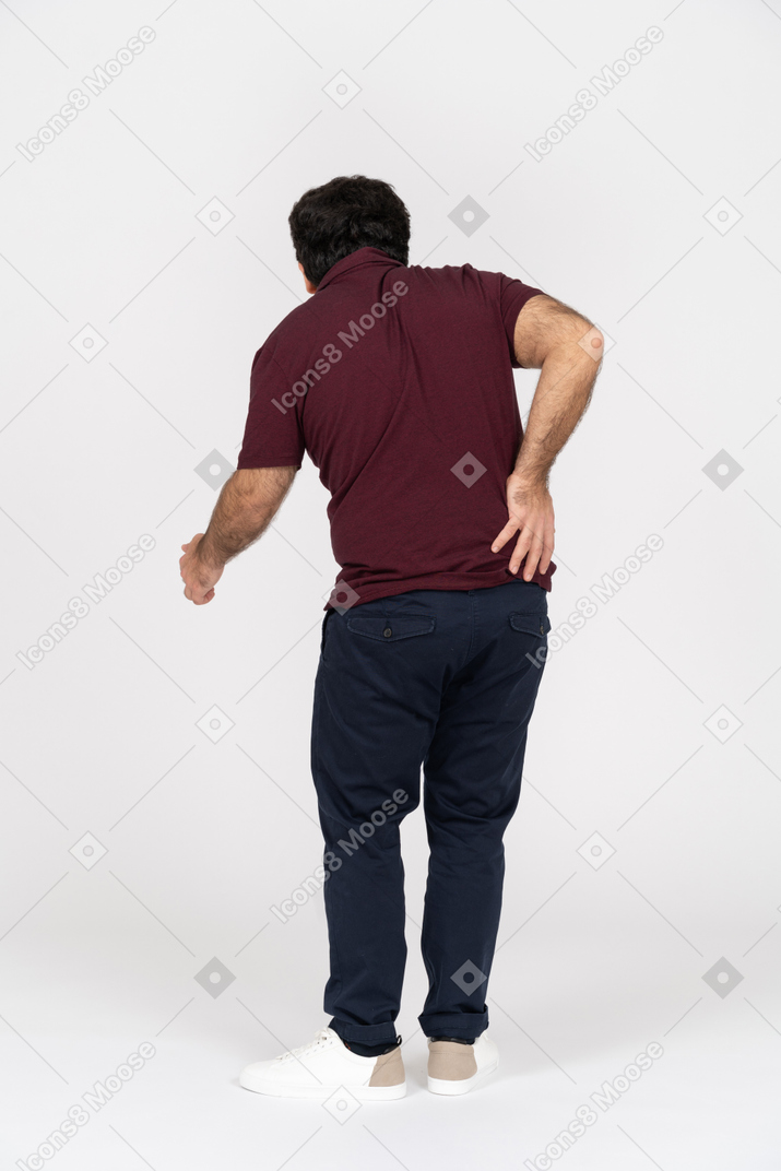 Rear view of a man with back pain